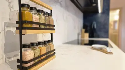 a spice rack in a kitchen with jars of spices at The Urban Retreat by LovelyStay in Funchal