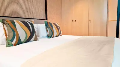 a large bed with two pillows on top of it at The Urban Retreat by LovelyStay in Funchal