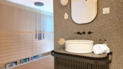 a bathroom with a sink and a mirror at The Urban Retreat by LovelyStay in Funchal