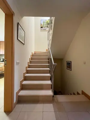 a stairway in a house with a stair case at No14 Lote B, Quinta da Belavista in Luz