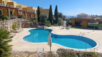 a swimming pool in the middle of a resort at No14 Lote B, Quinta da Belavista in Luz