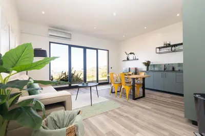 a living room with a couch and a table at The View Flat by Rent-a-key in Funchal