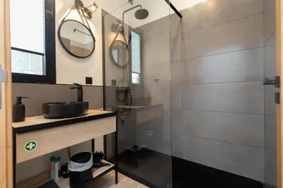 a bathroom with a shower and a sink at The View Flat by Rent-a-key in Funchal