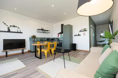 a living room with a couch and a table at The View Flat by Rent-a-key in Funchal