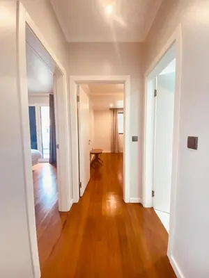 an empty hallway in a home with a hard wood floor at Village Square Coastal Apartment 3G in Machico