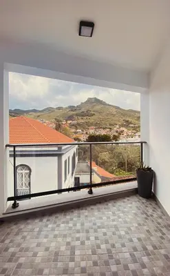 a balcony with a view of a mountain at Village Square Coastal Apartment 3G in Machico