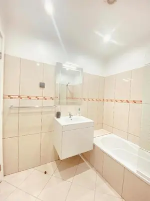 a bathroom with a tub and a sink and a bath tub at Village Square Coastal Apartment 3G in Machico