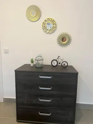 a dresser with a bike on top of a wall at Villa Do Calo in Sagres
