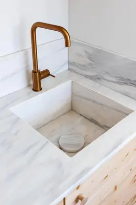 a bathroom sink with a toilet in it at Casa Primeira in Vila do Bispo