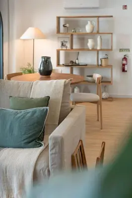 a living room with a couch and a table at Lazareto Sea View by An Island Apart in Funchal