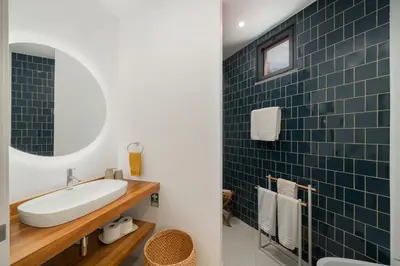 a bathroom with a sink and a mirror at Lazareto Sea View by An Island Apart in Funchal