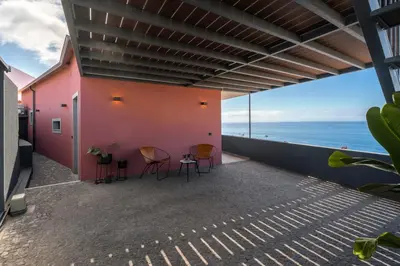 a balcony with chairs and a view of the ocean at Lazareto Sea View by An Island Apart in Funchal