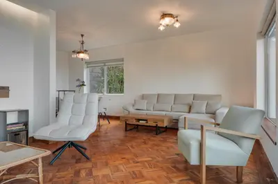 a living room with a couch and chairs and a table at Villa Natural Oasis with panoramic view & bio-diverse 9 950m2 garden in Funchal