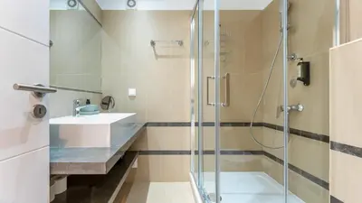 a bathroom with a shower and a sink at Villa Maya Luxurious House With Pool by LovelyStay in Luz