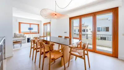 a kitchen and dining room with a table and chairs at Villa Maya Luxurious House With Pool by LovelyStay in Luz