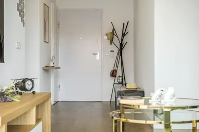 a living room with a glass table and a door at Penthouse A Fabrica by Homie in Funchal