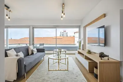 a living room with a couch and a table at Penthouse A Fabrica by Homie in Funchal
