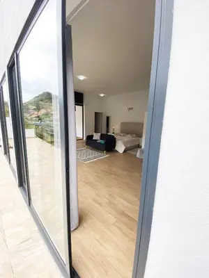 a view of a living room from a sliding glass door at Machico flat center near beach w parking in Machico