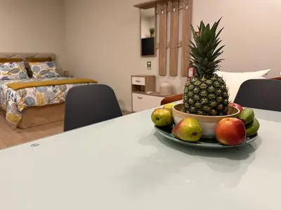 a bowl of fruit on a counter in a room at Bem Me Quer in Caniço