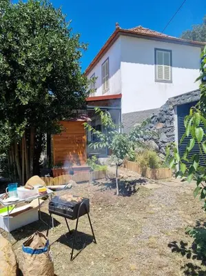 a backyard with a grill in front of a house at Quiet Countryside Nature Retreat in Santa Cruz
