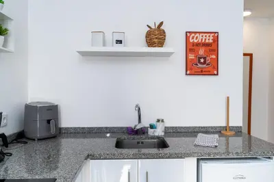 a kitchen with a sink and a counter top at Villas Renacer in Paul do Mar