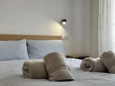 a bedroom with towels on a bed at Casa da Ribeira in Vila do Bispo