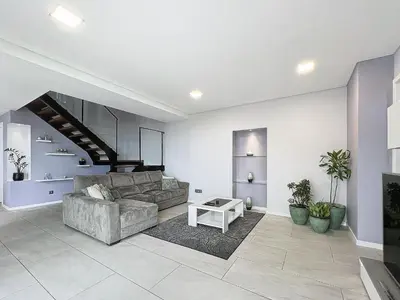 a living room with a couch and a table at Gertrudes Dream House in Ponta do Sol