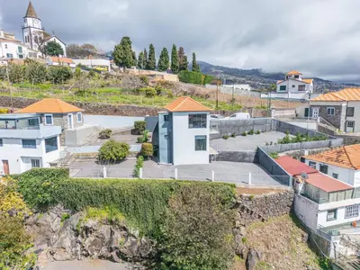 an aerial view of a city with buildings at Calheta Sunsets in Estreito da Calheta
