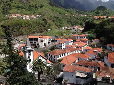 a small town with houses and a mountain at Holidays Madeira in São Vicente