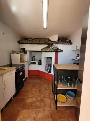a kitchen with a stove and a stove top oven at Sunset Paradise Villa with Heated Pool in Calheta