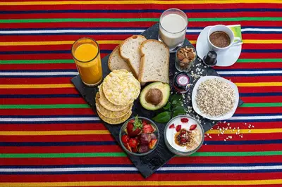 a tray of breakfast foods and drinks on a table at Living Funchal V in Funchal