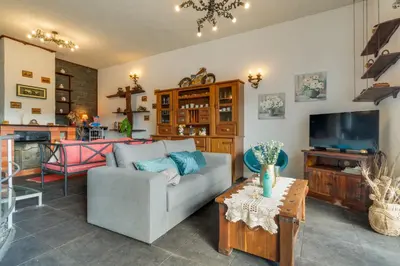 a living room with a couch and a tv at Sa Dias House by AH in São Jorge