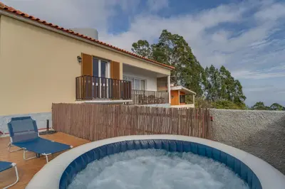 a hot tub in the backyard of a house at Sa Dias House by AH in São Jorge