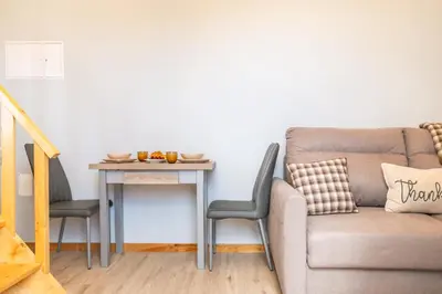 a living room with a couch and a table at Salsa Country House I I I in Porto Moniz
