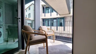 a pair of chairs sitting on a balcony at Daysy Loft by LovelyStay in Funchal