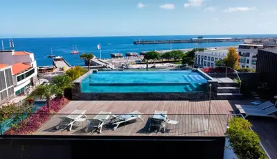 a swimming pool with a view of the ocean at Daysy Loft by LovelyStay in Funchal
