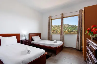 a hotel room with two beds and a window at Pico The Best View in Ribeira Brava