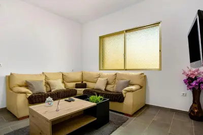 a living room with a couch and a coffee table at Pico The Best View in Ribeira Brava