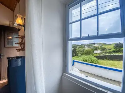 a window in a room with a view at Sun Island Retreat - Great Sunny Island Sea view in Vila do Porto