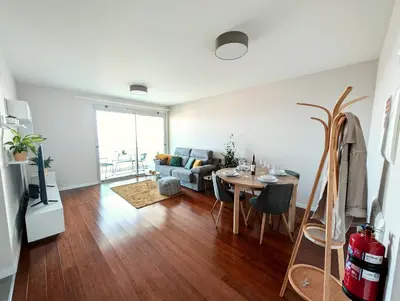 a living room with a table and a couch at Seaview wonder apartment by Anna in Funchal