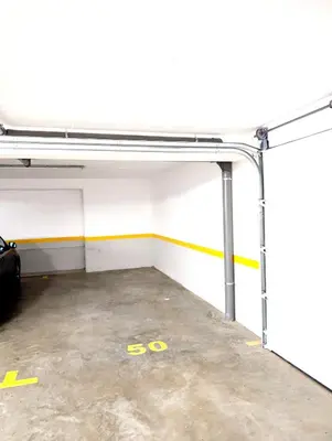 an empty garage with a car parked in it at Seaview wonder apartment by Anna in Funchal