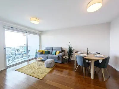 a living room with a table and a couch at Seaview wonder apartment by Anna in Funchal