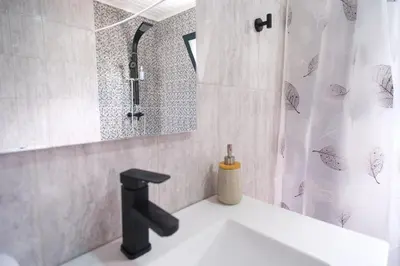 a bathroom with a sink and a shower at GuestReady - A lovely refuge in Madeira in Machico