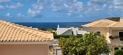 a view of the ocean from the roofs of houses at Casa Riomara in Lagos
