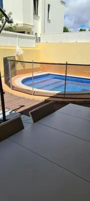 a swimming pool on the roof of a house at Casa Riomara in Lagos