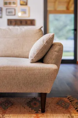 two pillows sitting on a couch in a living room at Mountain Chalet by Lavibes in São Vicente