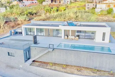 an aerial view of a house with a swimming pool at Vila Cales e Chadas by Your Madeira Rentals in Arco da Calheta