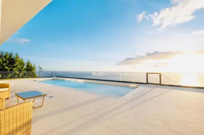 a swimming pool on the roof of a house at Vila Cales e Chadas by Your Madeira Rentals in Arco da Calheta