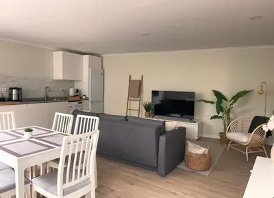 a living room with a couch and a table at Brooklyn&Fennel House in Funchal