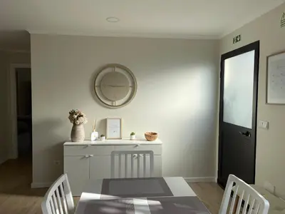 a dining room with a table and a mirror at Brooklyn&Fennel House in Funchal